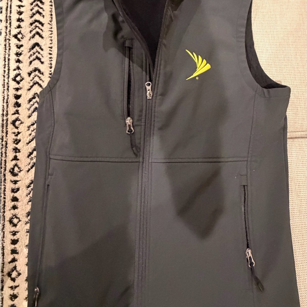 Storm Creek Men’s Gray Vest with Yellow Logo Sz small 
T1